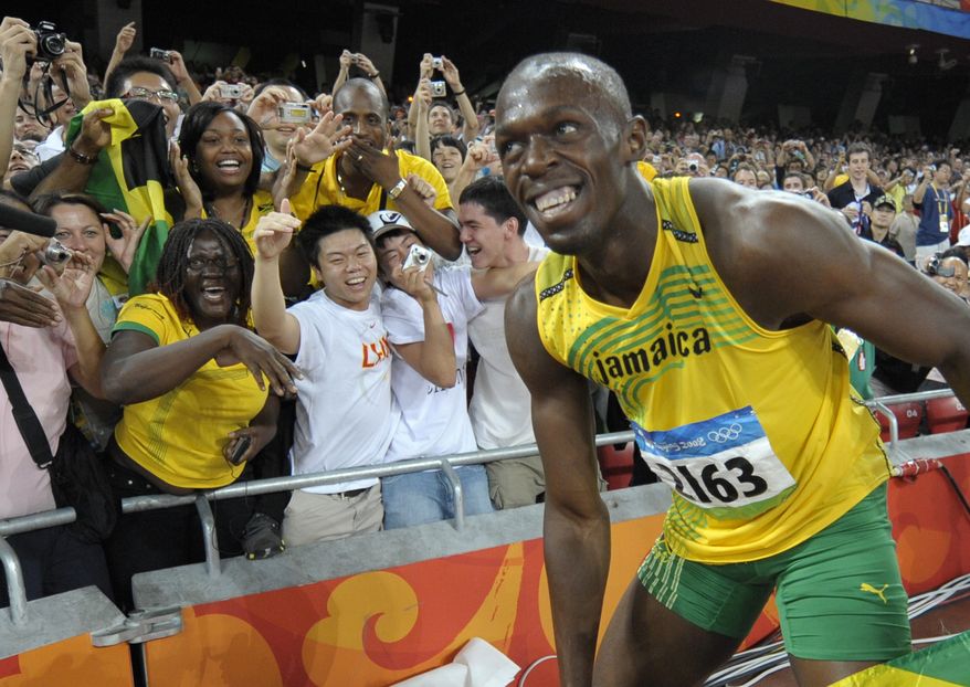 FILE - In this Aug. 16, 2008, file photo, Usain Bolt of Jamaica smiles at cheering spectators after winning the men's 100-meter final with a world record in the National Stadium at the Beijing 2008 Olympics in Beijing. Since he coasted to the 100-meter finish line in world-record time at the Bird's Nest eight years ago, Usain Bolt has been the smiling face of track and field. He has served as the anchorman of the Olympics, virtually the only reason any casual fan would pay attention to a sport that has orchestrated its own slow, sad, drug-infused downfall. (AP Photo/Thomas Kienzle, File)