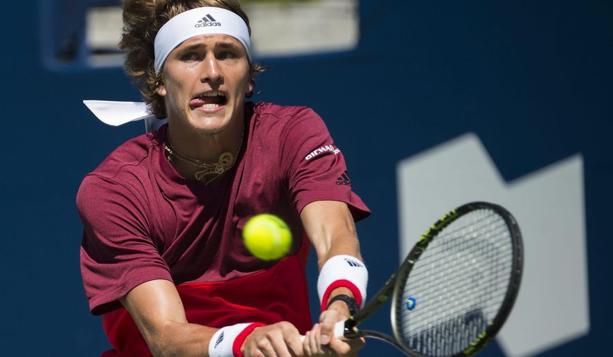 Alexander Zverev of Germany returns the ball against Yen-Hsun Lu of Taiwan during men&#x27;s second round Rogers Cup tennis action in Toronto on Tuesday, July 26, 2016. (Nathan Denette/The Canadian Press via AP)