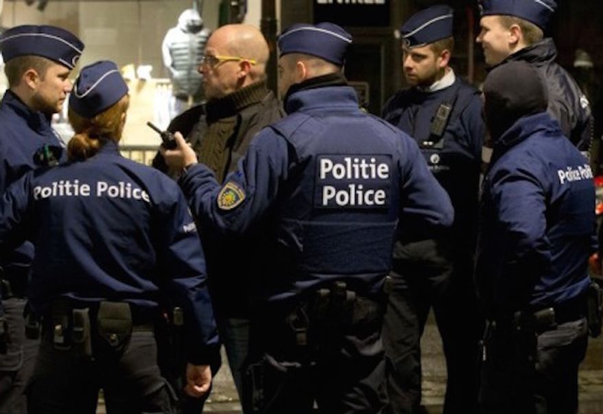 Police gather near a barricade in Brussels on Nov. 22, 2016. (Associated Press) **FILE**