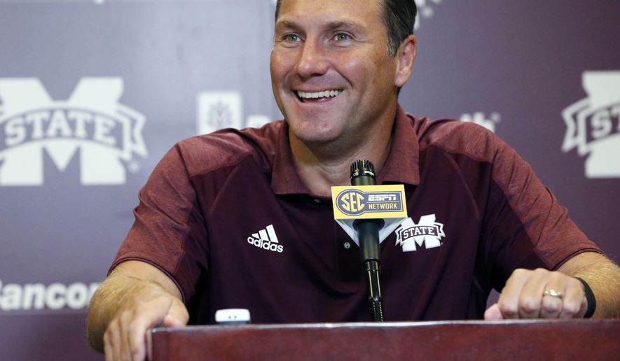 Mississippi State football coach Dan Mullen smiles at a reporter&#39;s question about the upcoming season during NCAA college football media day, Monday, Aug. 1, 2016, in Starkville, Miss. (AP Photo/Rogelio V. Solis)