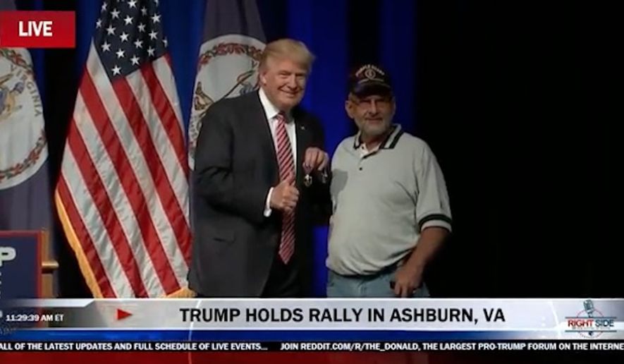 A man Donald Trump introduced as retired Lt. Col. Louis Dorfman presented the Republican presidential nominee with his Purple Heart during a rally Tuesday in Virginia. (YouTube/@Right Side Broadcasting)