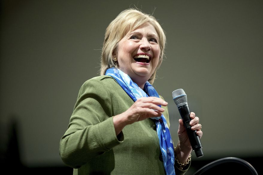 Democratic presidential candidate Hillary Clinton pauses while speaking at a rally at Adams City High School in Commerce City, Colo., Wednesday, Aug. 3, 2016. (AP Photo/Andrew Harnik)