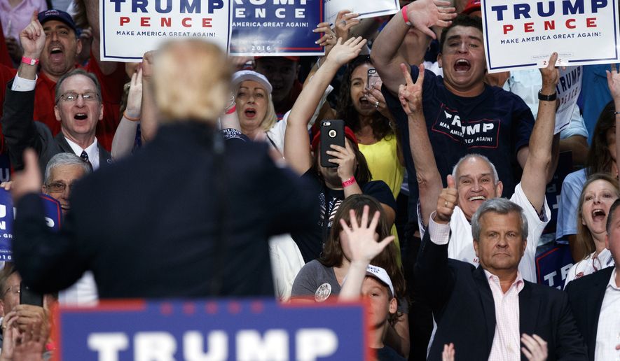 Republican presidential candidate Donald Trump waves to supporters during a campaign town hall at Ocean Center, Wednesday, Aug. 3, 2016, in Daytona Beach, Fla. (AP Photo/Evan Vucci)