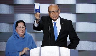 Khizr Khan, father of fallen US Army Capt. Humayun S. M. Khan speaks as his wife Ghazala listens during the final day of the Democratic National Convention in Philadelphia , Thursday, July 28, 2016. (AP Photo/J. Scott Applewhite)