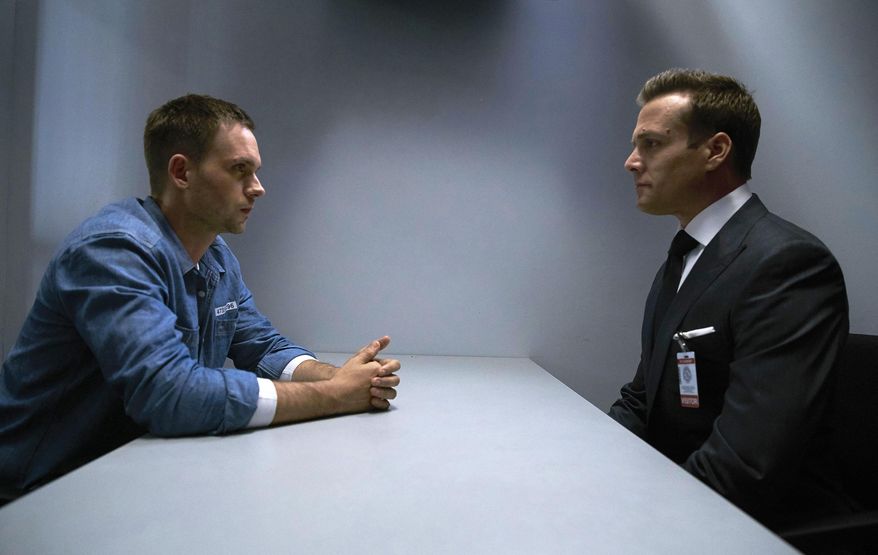 This image released by USA Network shows Patrick J. Adams, left, and Gabriel Macht in a scene from the series, "Suits." USA Network said Wednesday, Aug. 3, 2016, the drama series has been renewed for its seventh season. (Shane Mahood/USA Network via AP)