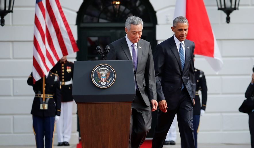 President Obama and visiting Singaporean Prime Minister Lee Hsien Loong warned Tuesday about the implications of a failed Trans-Pacific Partnership, including a trade deal with low standards. (Associated Press)
