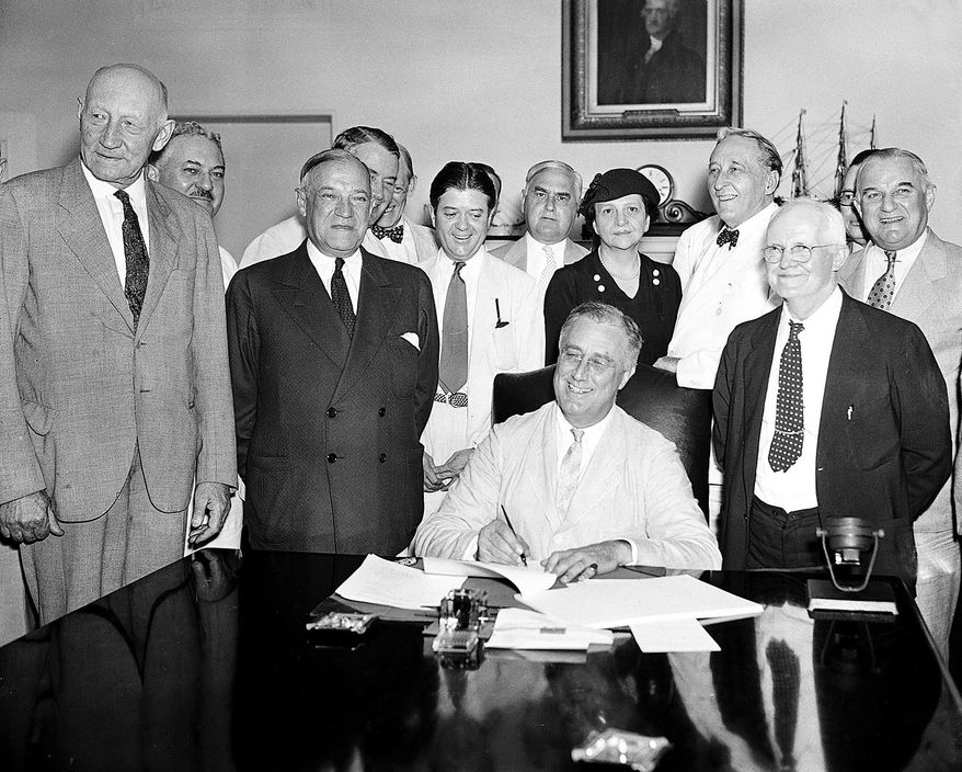 FLE - In this Aug. 14, 1935, file photo President Franklin Roosevelt signs the Social Security bill in Washington. Americans are getting older, but not this old: Social Security records show that 6.5 million people in the U.S. have reached the ripe old age of 112. In reality, only few could possibly be alive. As of last fall, there were only 42 people known to be that old in the entire world. But Social Security does not have death records for millions of people with birth dates stretching back as far as 1869, according to a report by the agency’s inspector general. The first old-age monthly benefit check was paid in 1940, after President Franklin D. Roosevelt had signed the Social Security Act in 1935. (AP Photo, File)