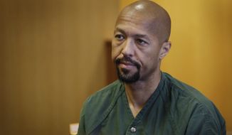 Ex-Detroit City Council president and former TV news anchor Charles Pugh returns to a courtroom during his preliminary trial Friday Aug. 5, 2016 at the Frank Murphy Hall of Justice in Detroit. (Mandi Wright/Detroit Free Press via AP)