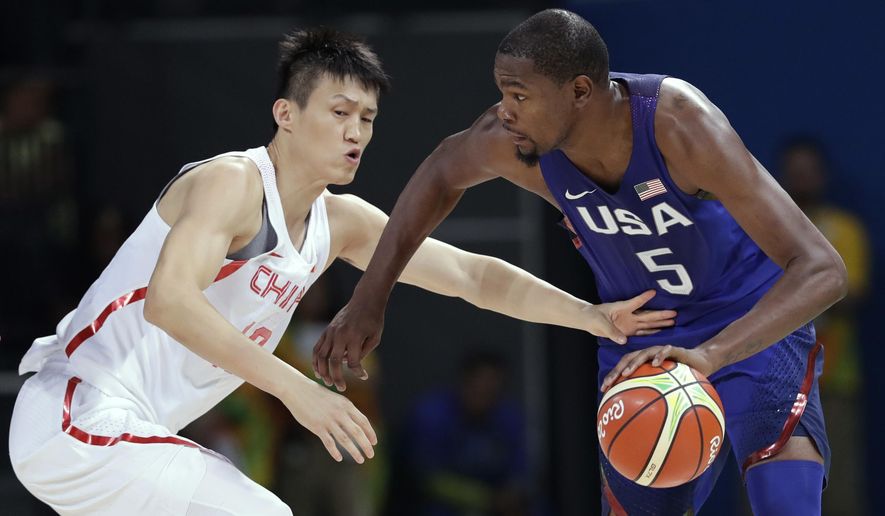 United States&#39; Kevin Durant (5) drives past China&#39;s Zou Peng, left, during a basketball game at the 2016 Summer Olympics in Rio de Janeiro, Brazil, Saturday, Aug. 6, 2016. (AP Photo/Charlie Neibergall)