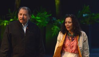 Nicaraguan President Daniel Ortega and his wife, Rosario Murillo, are accused by critics of running the Central American country as if it were their own and doing everything they can to cement family power. (Associated Press) ** FILE **