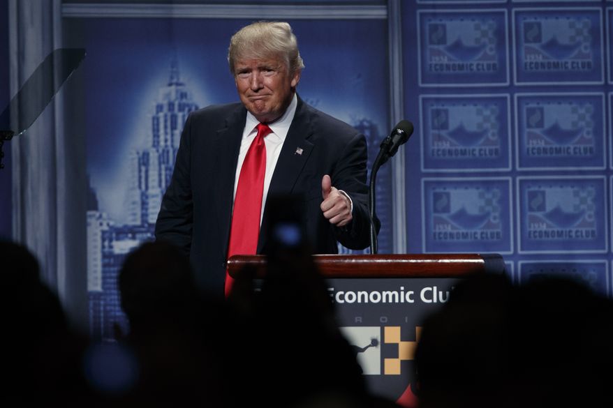 Republican presidential candidate Donald Trump gives a thumbs up after delivering an economic policy speech to the Detroit Economic Club, Monday, Aug. 8, 2016, in Detroit. (AP Photo/Evan Vucci)