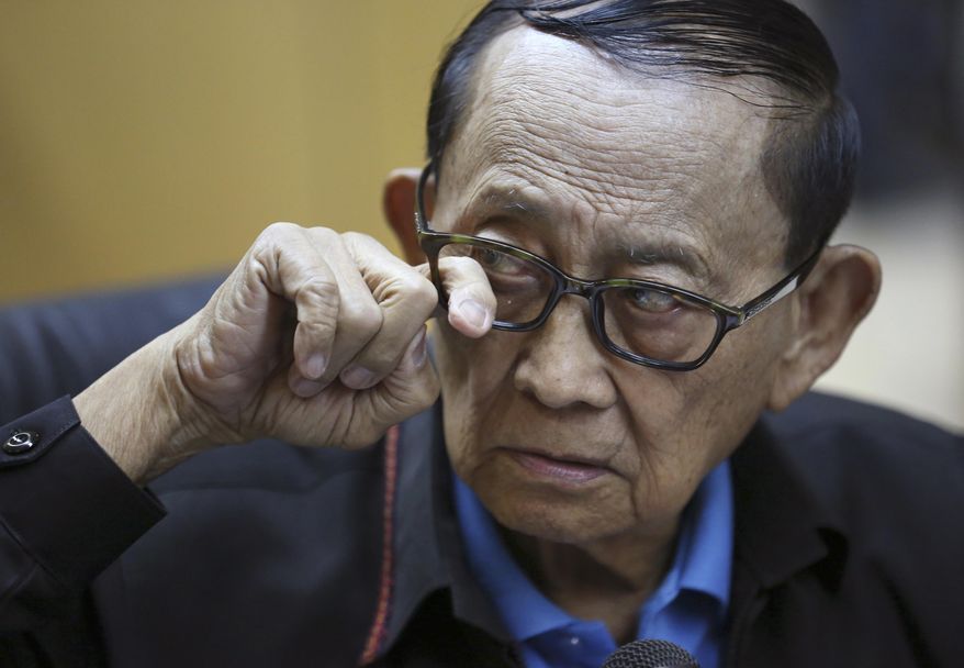 Former Philippine President Fidel Ramos pokes his eyewear to show reporters that it doesn't have any glass during a press conference before his flight at Manila's International Airport in suburban Pasay, south of Manila, Philippines, Monday, Aug. 8, 2016. Ramos flew to Hong Kong on Monday for talks with long-standing contacts after being asked by current President Rodrigo Duterte to travel to China and start discussions on the South China Sea. (AP Photo/Aaron Favila)