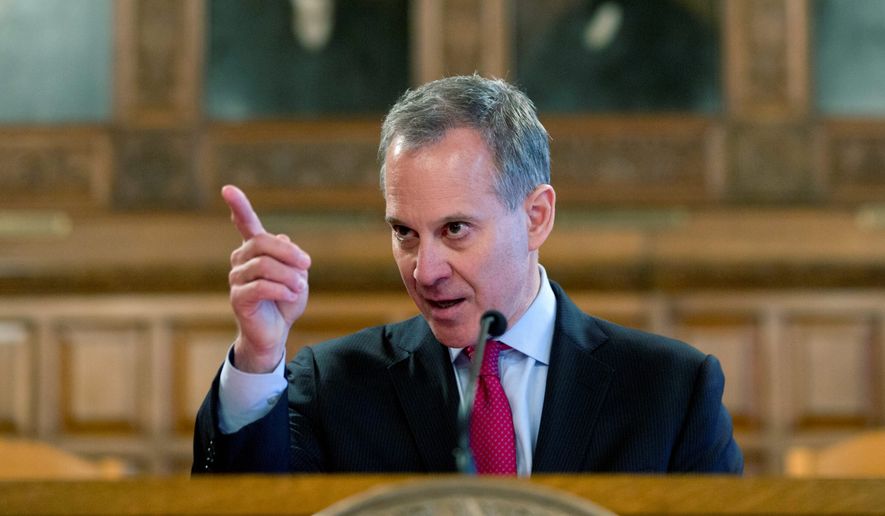 New York Attorney General Eric T. Schneiderman continued his crusade against energy giant Exxon, saying that no company, &quot;no matter how rich or powerful,&quot; is above the law. (Associated Press)