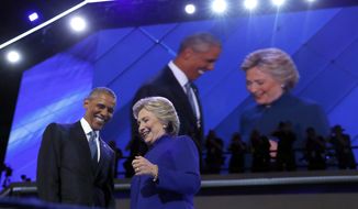 President Obama is joined by Democratic presidential candidate Hillary Clinton after speaking to the delegates during the third day session of the Democratic National Convention in Philadelphia on July 27, 2016. (Associated Press) **FILE**