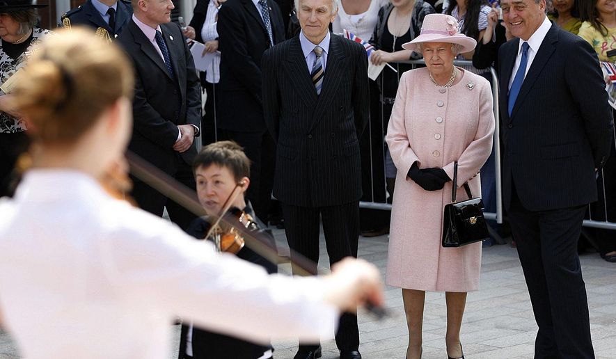 FILE - In this file photo dated Thursday May 22, 2008, Britain's Queen Elizabeth II, second right, with the Duke of Westminster, right, and Rod Holmes, third right, to watch a musical performance in Liverpool, England. The Duke of Westminster Gerald Cavendish Grosvenor, a friend of Britain's royal family and one of Britain's wealthiest landowners has died aged 64, his family said Tuesday Aug. 10, 2016. (AP Photo/Paul Thomas, FILE)