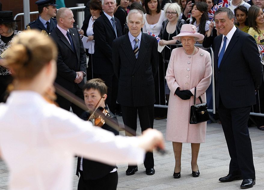 FILE - In this file photo dated Thursday May 22, 2008, Britain's Queen Elizabeth II, second right, with the Duke of Westminster, right, and Rod Holmes, third right, to watch a musical performance in Liverpool, England. The Duke of Westminster Gerald Cavendish Grosvenor, a friend of Britain's royal family and one of Britain's wealthiest landowners has died aged 64, his family said Tuesday Aug. 10, 2016. (AP Photo/Paul Thomas, FILE)
