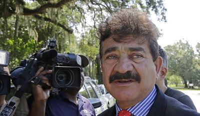 In this June 15, 2016, file photo, Seddique Mir Mateen, father of Omar Mateen, who died in a gun battle with a SWAT team after he opened fire at the gay nightclub Pulse early Sunday, talks to reporters, across the street of a residence owned by the family, in Fort Pierce, Fla. (AP Photo/Alan Diaz, File)