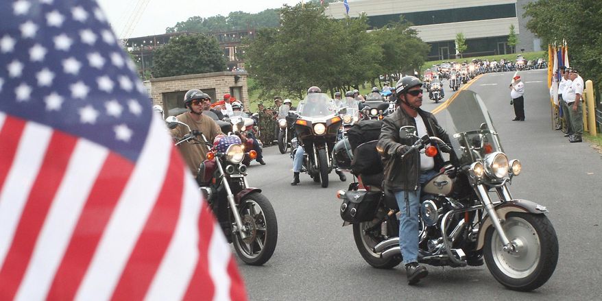 In this Aug. 17, 2007 file photo, motorcyclists enter Allegany College of Maryland in Cumberland, Md., for a regrouping stop as they participate in the annual America's 9/11 Ride. Leaders of the massive, annual motorcycle procession to the three Sept. 11 crash sites say the ride Aug. 19-21, 2016 will be their last. (John A. Bone/Cumberland Times-News via AP)
