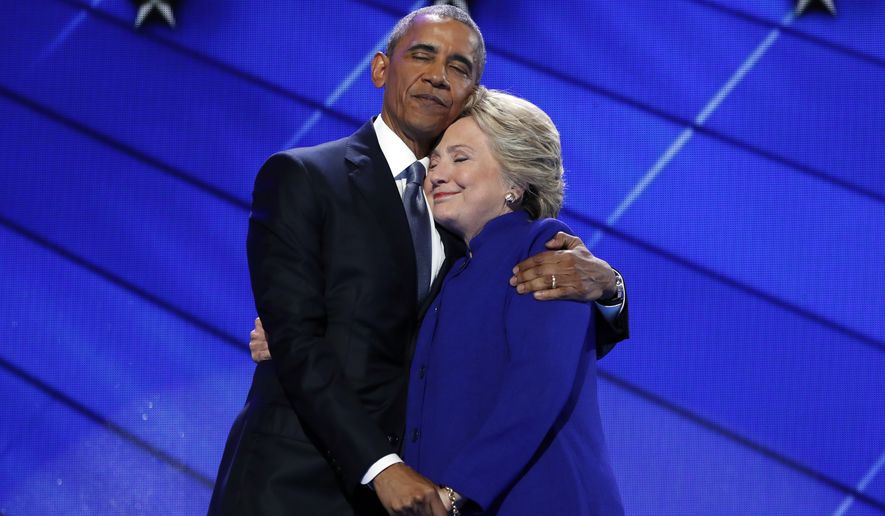 President Barack Obama hugs Democratic Presidential candidate Hillary Clinton after addressing the delegates during the third day session of the Democratic National Convention in Philadelphia, Wednesday, July 27, 2016. (AP Photo/Carolyn Kaster) **FILE**