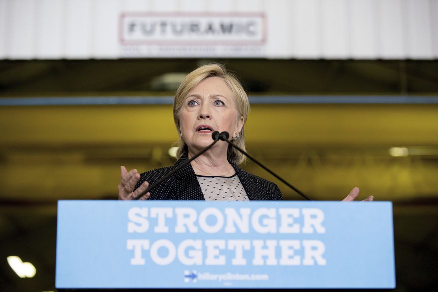 Democratic presidential candidate Hillary Clinton gives a speech on the economy after touring Futuramic Tool &amp; Engineering, in Warren, Mich., Thursday, Aug. 11, 2016. (AP Photo/Andrew Harnik)
