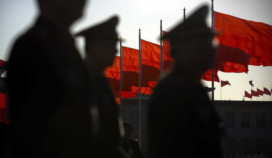 Chinese People&#39;s Liberation Army delegates arrive at the Great Hall of the People before a plenary session of the National People&#39;s Congress in Beijing on March 13. (Associated Press)
