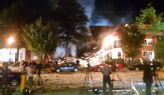 This Wednesday, Aug. 10, 2016, shows the Piney Branch Road apartment fire with structural collapse in Silver Spring, Md. Fire officials say at least 20 to 25 people, including two firefighters, have been injured in a large fire at an apartment building in a Maryland suburb of Washington. According to the Montgomery County Fire and Rescue Service, first responders were dispatched to the scene in Silver Spring just before midnight Wednesday. (Montgomery County Fire and Rescue via AP)