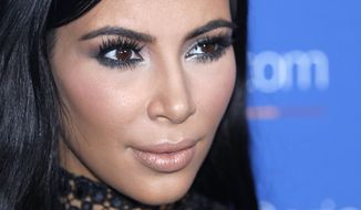 FILE - In this June 24, 2015, file photo, Kim Kardashian poses during a photo call at the Cannes Lions 2015, International Advertising Festival in Cannes, southern France. Kardashian said on Twitter August 3, 2016, that her BlackBerry smartphone died. (AP Photo/Lionel Cironneau, File)