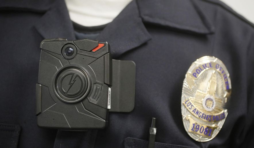 In this Jan. 15, 2014, file photo a Los Angeles Police officer wears an on-body camera during a demonstration in Los Angeles. (AP Photo/Damian Dovarganes, File)
