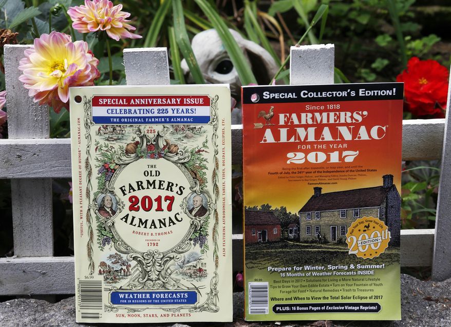 This Aug. 12, 2016 photo shows the 2017 editions of New Hampshire's Old Farmer's Almanac, left, and Maine's Farmers' Almanac photographed in Concord, N.H. The two publications, which will be released soon, are both celebrating milestones. Maine's 200 edition, and New Hampshire's 225.(AP Photo/Jim Cole)