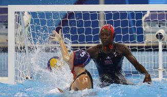 United States&#39; Ashleigh Johnson makes a save during their women&#39;s water polo quarterfinal match against Brazil at the 2016 Summer Olympics in Rio de Janeiro, Brazil, Monday, Aug. 15, 2016. (AP Photo/Sergei Grits)