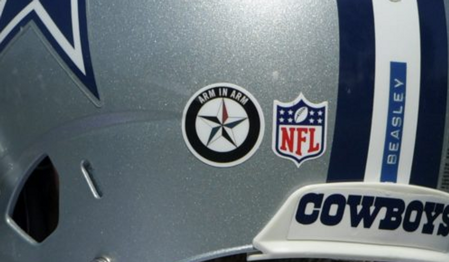 An example of the Arm in Arm tribute decal worn on helmets during practices of the Dallas Cowboys.