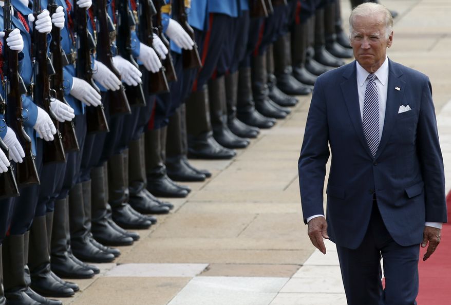 Vice President Joseph R. Biden reviews the honor guard upon his arrival at the Serbia Palace to meet with Prime Minister Aleksandar Vucic in Belgrade on Tuesday. (Associated Press)