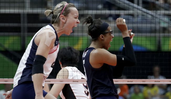 United States&#x27; Kayla Banwarth, left, and Rachael Adams celebrate during a women&#x27;s quarterfinal volleyball match against Japan at the 2016 Summer Olympics in Rio de Janeiro, Brazil, Tuesday, Aug. 16, 2016. (AP Photo/Jeff Roberson)
