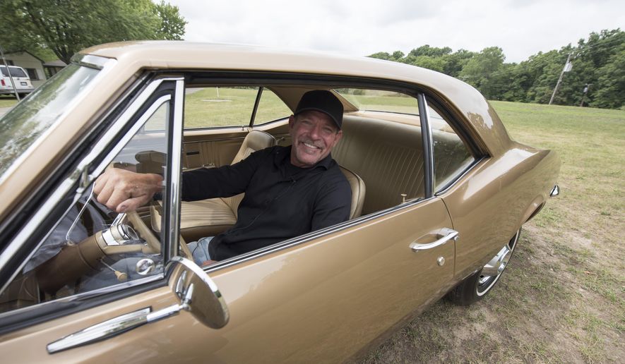 Corey Lawson behind the wheel of his son's 1967 pre-production pilot prototype Chevrolet Camaro, Monday, Aug. 15, 2016. The 1967 Chevrolet Camaro is being added to the National Historic Vehicle Register. Historic Vehicle Association president Mark Gessler told The Detroit News that it'll become the 15th car on the list during a news conference in Birmingham on Wednesday, Aug. 17, 2016. "It's a very big honor," said Corey Lawson, who bought the car in 2009 after seeing it for sale on online auctioneer site eBay. "It's reserved for the most historic of the historic vehicles." (David Guralnick/Detroit News via AP)