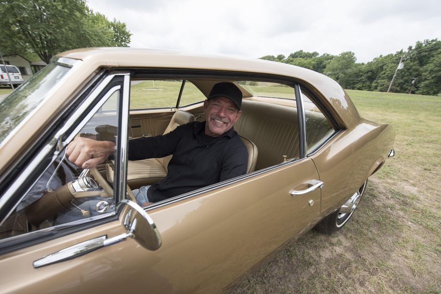 Corey Lawson behind the wheel of his son's 1967 pre-production pilot prototype Chevrolet Camaro, Monday, Aug. 15, 2016. The 1967 Chevrolet Camaro is being added to the National Historic Vehicle Register. Historic Vehicle Association president Mark Gessler told The Detroit News that it'll become the 15th car on the list during a news conference in Birmingham on Wednesday, Aug. 17, 2016. "It's a very big honor," said Corey Lawson, who bought the car in 2009 after seeing it for sale on online auctioneer site eBay. "It's reserved for the most historic of the historic vehicles." (David Guralnick/Detroit News via AP)