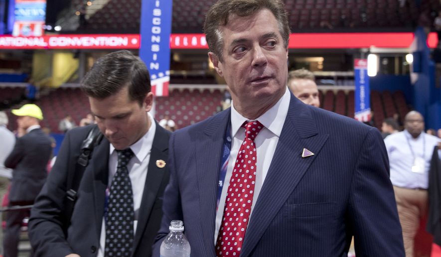 FILE - In this July 18, 2016, file photo, Trump campaign chairman Paul Manafort walks around the convention floor before the opening session of the Republican National Convention in Cleveland.  (AP Photo/Carolyn Kaster, File)