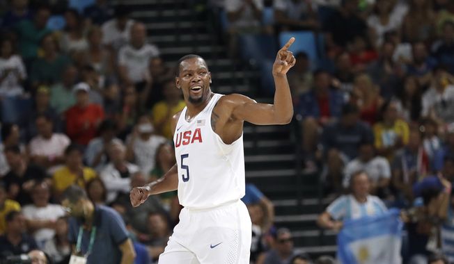 United States&#x27; Kevin Durant (5) signals to teammates after he scored against Argentina during a men&#x27;s quarterfinal round basketball game at the 2016 Summer Olympics in Rio de Janeiro, Brazil, Wednesday, Aug. 17, 2016. (AP Photo/Eric Gay)