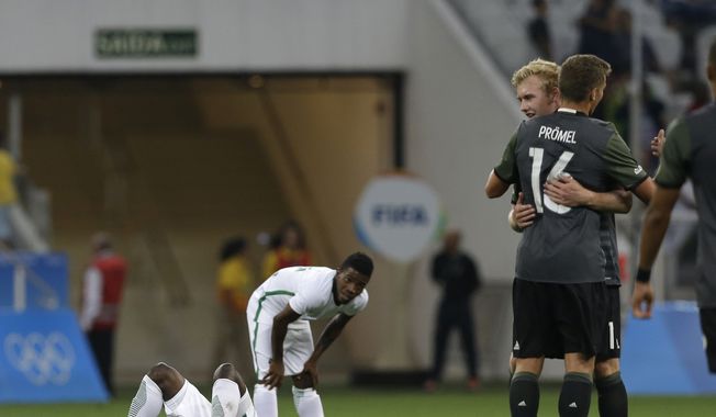 Germany&#x27;s players, right, celebrate after qualifying for the final at the end of a semifinal match of the men&#x27;s Olympic football tournament against Nigeria in Sao Paulo, Wednesday Aug. 17, 2016. Germany won 2-0 and will play the final against Brazil.(AP Photo/Leo Correa)