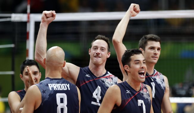 United States&#x27; Kawika Shoji (7), celebrates with teammates Matthew Anderson (1), David Lee (4), and William Reid Priddy (8) after defeating Poland in a men&#x27;s quarterfinal volleyball match at the 2016 Summer Olympics in Rio de Janeiro, Brazil, Wednesday, Aug. 17, 2016. (AP Photo/Robert F. Bukaty)