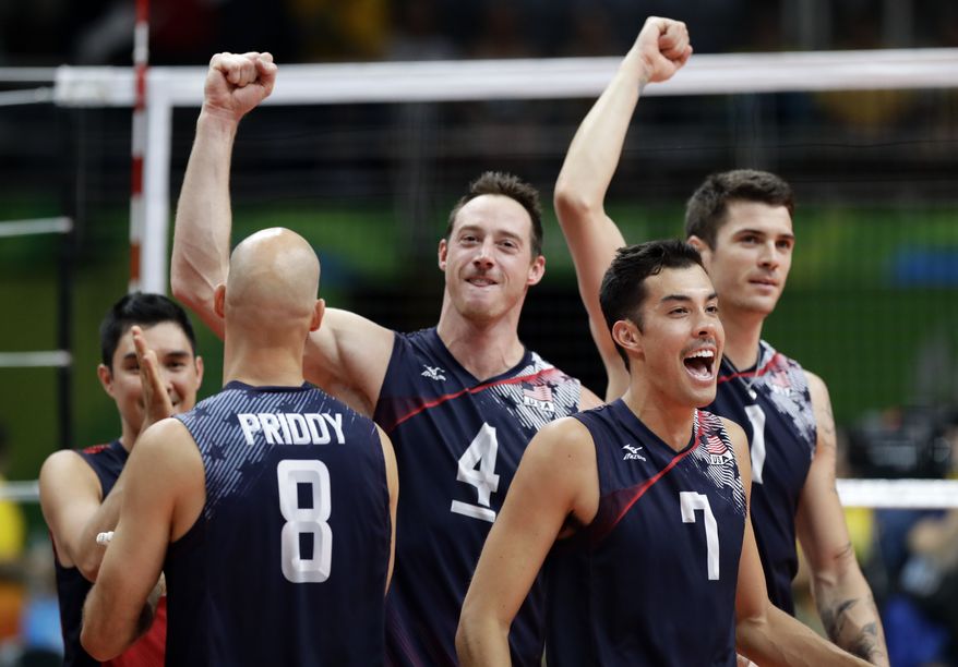 United States' Kawika Shoji (7), celebrates with teammates Matthew Anderson (1), David Lee (4), and William Reid Priddy (8) after defeating Poland in a men's quarterfinal volleyball match at the 2016 Summer Olympics in Rio de Janeiro, Brazil, Wednesday, Aug. 17, 2016. (AP Photo/Robert F. Bukaty)