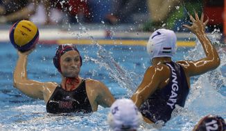 United States&#39; Courtney Mathewson,left, shoot the ball as Hungary&#39;s Anna Ille, right, goes to block during their women&#39;s semifinal water polo match at the 2016 Summer Olympics in Rio de Janeiro, Brazil, Wednesday, Aug. 17, 2016. (AP Photo/Eduardo Verdugo)