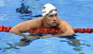 Ryan Lochte&#39;s claim of being robbed is being viewed with skepticism by Brazilian authorities, who detained three of his teammates Wednesday to prevent them from leaving the country. (Associated Press)