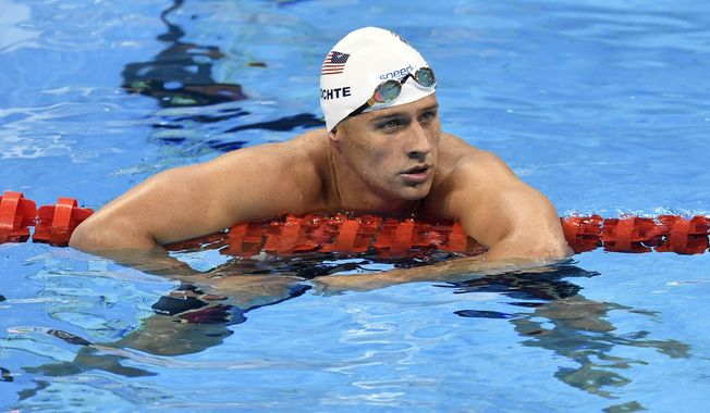 Ryan Lochte&#x27;s claim of being robbed is being viewed with skepticism by Brazilian authorities, who detained three of his teammates Wednesday to prevent them from leaving the country. (Associated Press)
