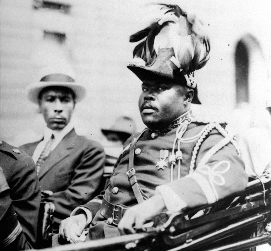 FILE - In this August 1922 file photo, Marcus Garvey is shown in a military uniform as the "Provisional President of Africa" during a parade on the opening day of the annual Convention of the Negro Peoples of the World along Lenox Avenue in Harlem borough of New York. The son ofMarcus Garvey on Aug. 17, 2016, said his father’s 129th birthday marked the perfect day to begin a public push for a presidential pardon to exonerate Garvey for an unjust conviction. Dr. Julius W. Garvey wants President Barack Obama to clear his father’s name from a mail fraud conviction that caused Marcus Garvey to be deported from the United States to his native Jamaica. (AP Photo/File)