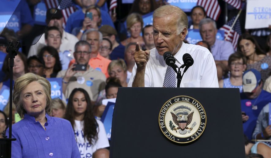 Democratic presidential candidate Hillary Clinton listens, left, listens as Vice President Joe Biden addresses a gathering at a campaign rally Monday, Aug. 15, 2016, in Scranton, Pa. (AP Photo/Mel Evans)  **FILE**