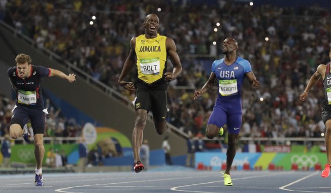Usain Bolt from Jamaica, second left, crosses the line to win the gold medal in the men&#x27;s 200-meter final ahead of second placed Canada&#x27;s Andre De Grasse, right, and third placed France&#x27;s Christophe Lemaitre, left, during the athletics competitions of the 2016 Summer Olympics at the Olympic stadium in Rio de Janeiro, Brazil, Thursday, Aug. 18, 2016. (AP Photo/David J. Phillip)