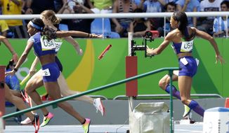 English Gardner and Allyson Felix, right, from the United States drop the baton in a women&#39;s 4x100-meter relay heat during the athletics competitions of the 2016 Summer Olympics at the Olympic stadium in Rio de Janeiro, Brazil, Thursday, Aug. 18, 2016. (AP Photo/Matt Dunham)