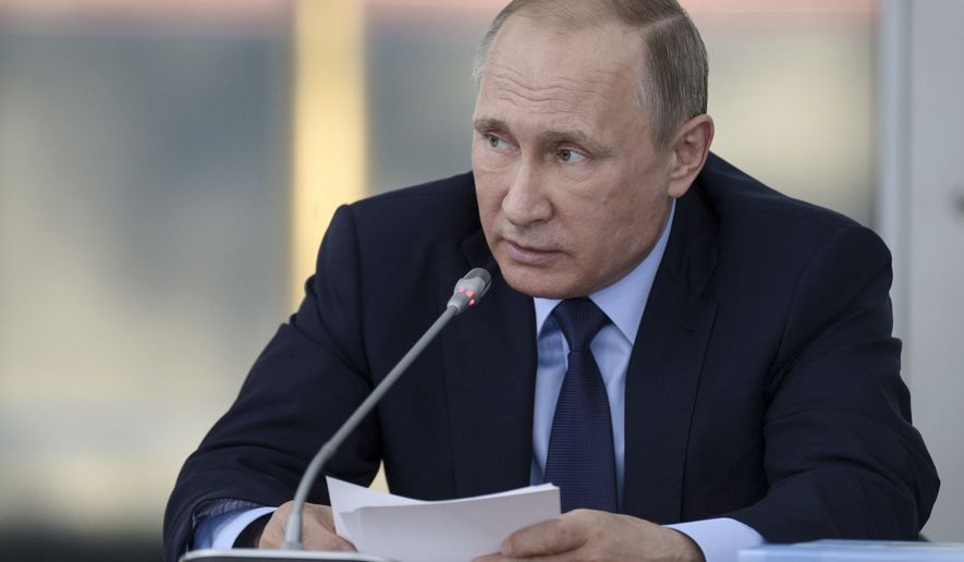 Russian President Vladimir Putin also is building up forces on the Ukraine border and setting up military posts in the Arctic. (Associated Press)