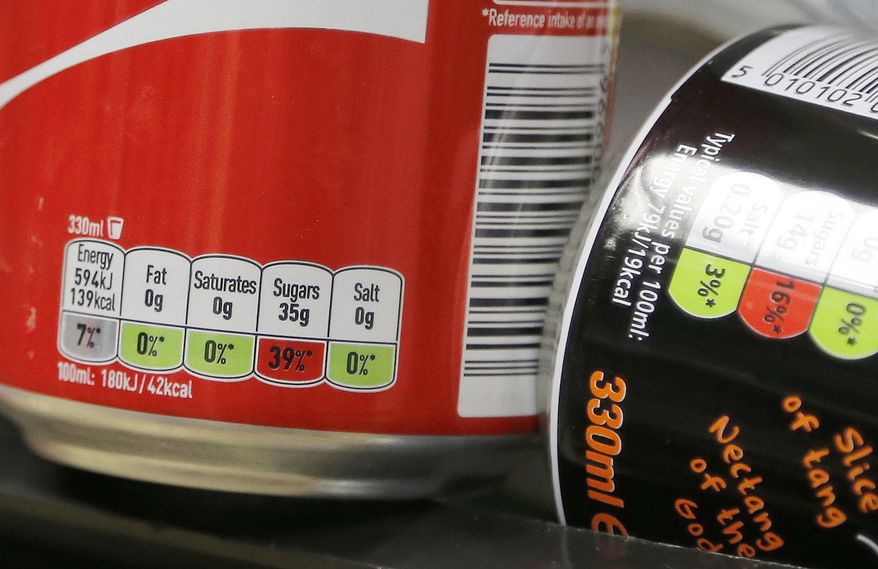 Legislators in Arkansas are debating a bill that would forbid using food stamps for purchase of food and drink considered to be "junk food" of questionable nutritional benefit. In this Aug. 18, 2016 file photo, the amount of sugar contained in drinks is on display at a shelf in a supermarket in London. (AP Photo/Frank Augstein) **FILE**