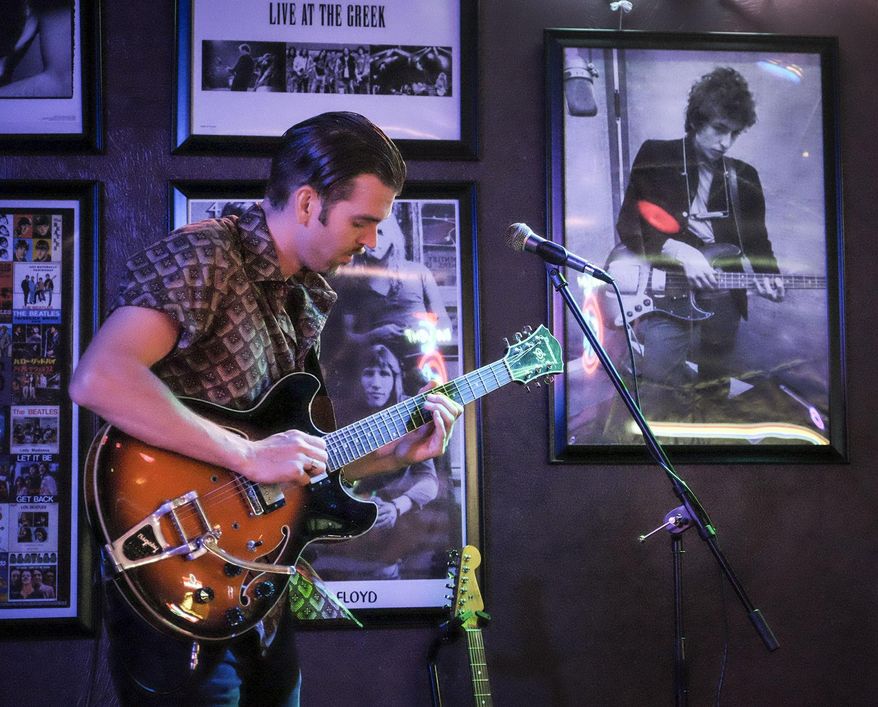 ADVANCE FOR USE SUNDAY, AUG. 21, 2016 AND THEREAFTER - In this Aug. 2, 2016 photo, Ivas John warms up during a soundcheck for his band's performance at John Brown's on the Square in Marion, Ill. Originality, and a love for live music, is what you will find in Southern Illinois. Those looking for a live show in the area don't have to look very long or hard to a find young, local band paying its dues to play for a crowd. Most of the shows take place in Carbondale, but venues are available in Marion, Murphysboro, and several of the smaller towns that make up this region. (Byron Hetzler/The Southern, via AP)